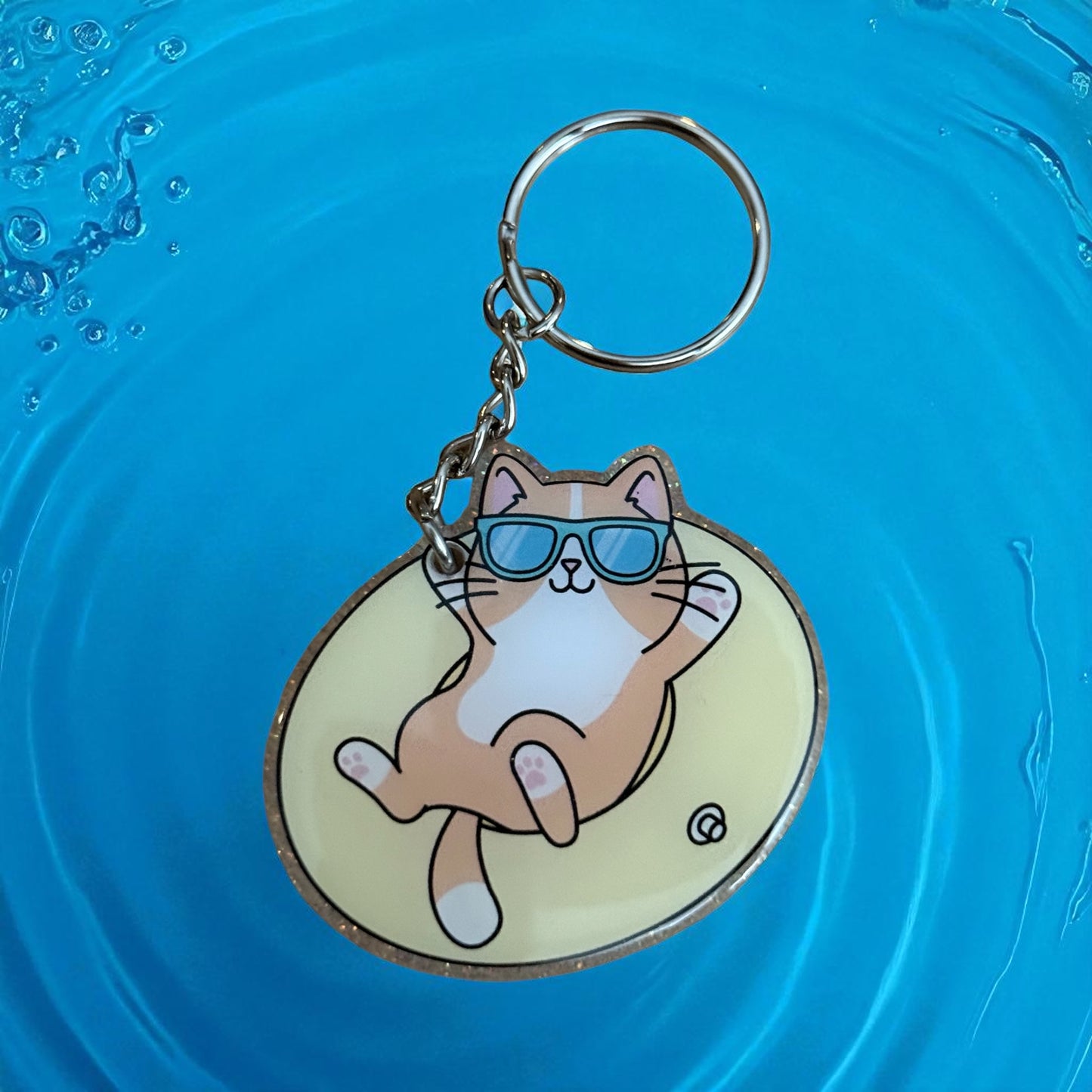 Cat with Sunglasses on Inner Tube - colorful glitter background