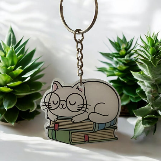 Sleeping Cat with Glasses on Books Keychain